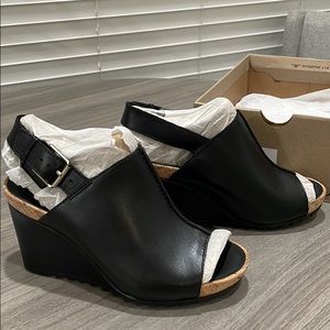Black leather Clark’s Wedges